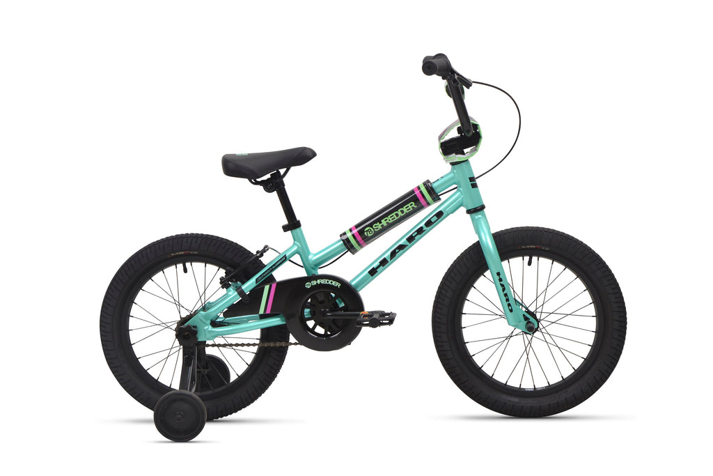 A Shredder 16 ST teal girls bike with training wheels, black seat, low top tube, and black tires is shown side view on white background.
