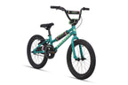 A teal Shredder 18 ST girls' bike with black tires, black seat, low top tube, green and purple accents; no training wheels.