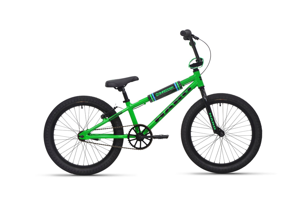 Shredder 20 BMX bike with bright green alloy frame, 20" wheels, black tires, seat, and handlebars on white background.